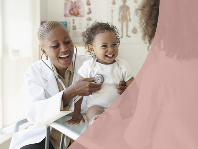 Doctor and baby smiling